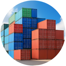 Stacked shipping containers in a storage facility under a clear blue sky.